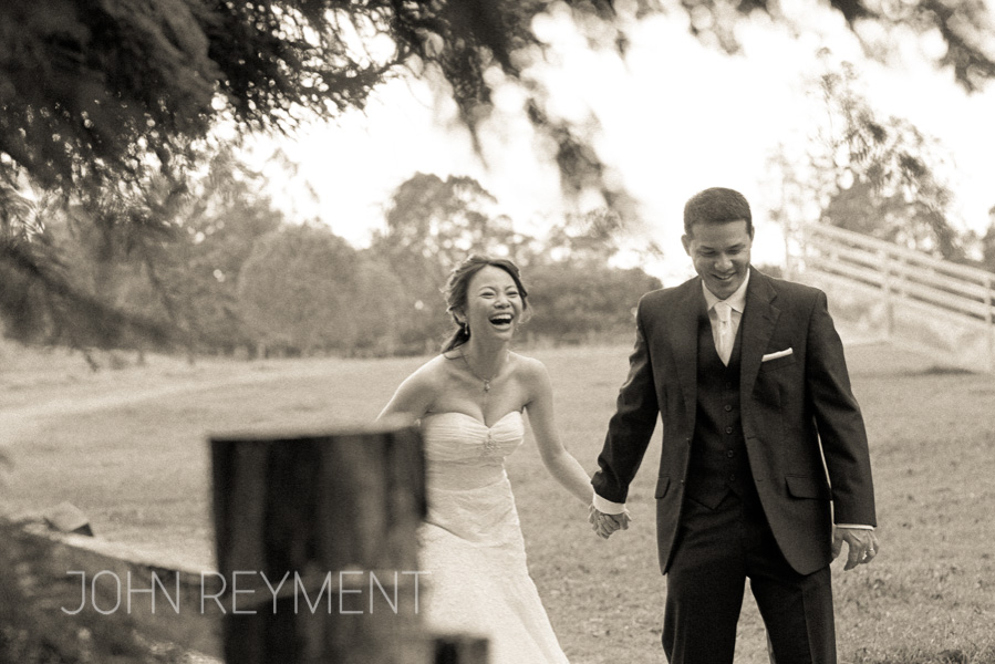 Candid moment with bride and groom by brisbane wedding photographer John Reyment